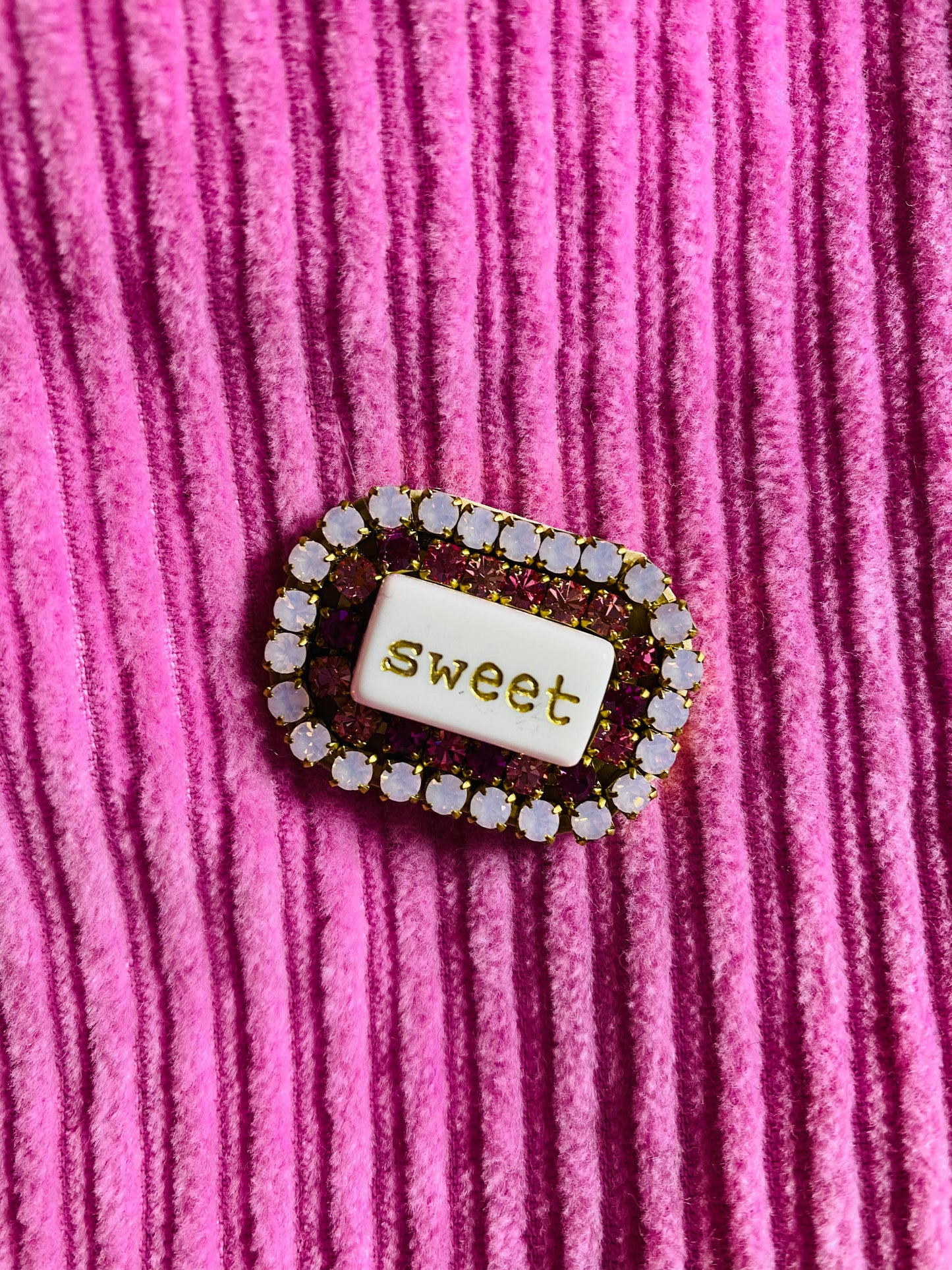 “WORD” rhinestone brooch