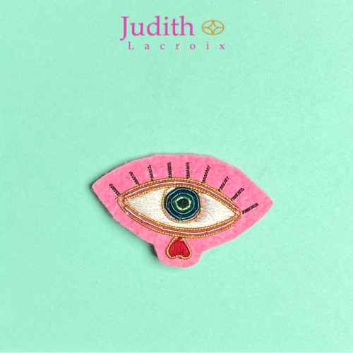 Pink eye brooch