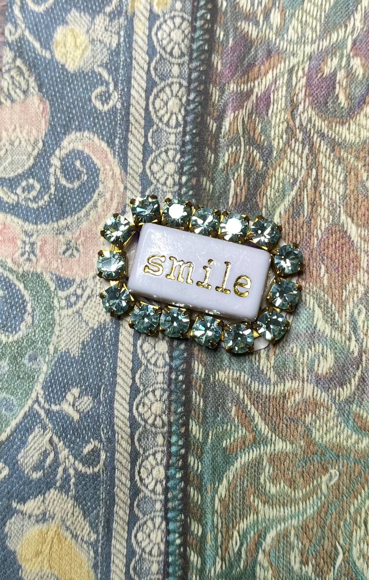 “WORD” rhinestone brooch