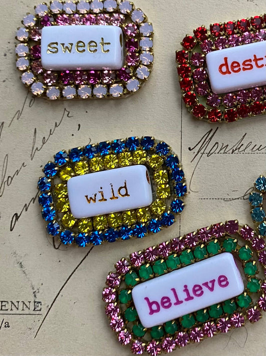 “WORD” rhinestone brooch